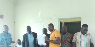 Hon. Jim Muhwezi fulfills the pledge of fishing Licenses to Rwenshama community