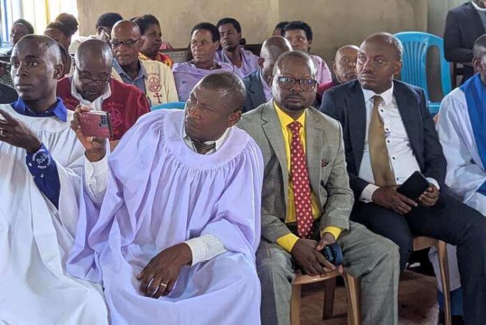 Hon Rutahigwa and Counsel Isaac attending service at Kyatoko COU
