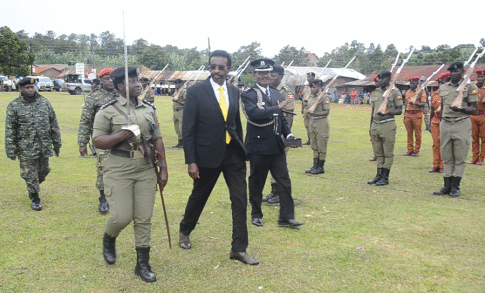 Minister Muhwezi inspecting Guard of Honour mounted by Police and Prisons