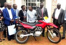 Centenary Bank Donates Motorcycle to Enhance Parish Development Model in Rukungiri
