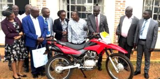 Centenary Bank Donates Motorcycle to Enhance Parish Development Model in Rukungiri