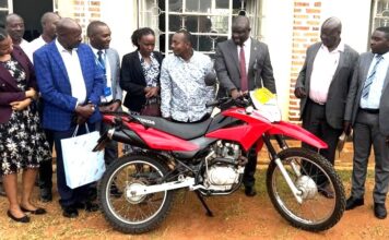 Centenary Bank Donates Motorcycle to Enhance Parish Development Model in Rukungiri