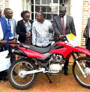 Centenary Bank Donates Motorcycle to Enhance Parish Development Model in Rukungiri